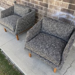 Pair of tweed lounge chairs on walnut legs