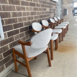 Danish teak chairs reupholstered in bouclé