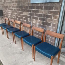 Set of teak dining chairs in navy leather